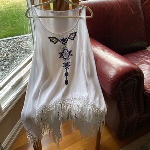 White Peter Nygard sleeveless Top with design and fringe. Hangs beautifully.